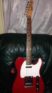 This is the guitar I salvaged from my basement, a survivor of Hurricane Irene. One day, I'm going to learn to play it.
