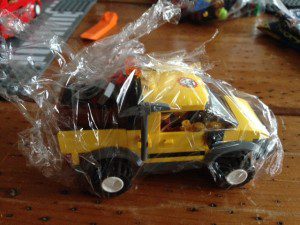 This mining truck had a lot of small pieces. By shrink-wrapping them, I could keep them all together.