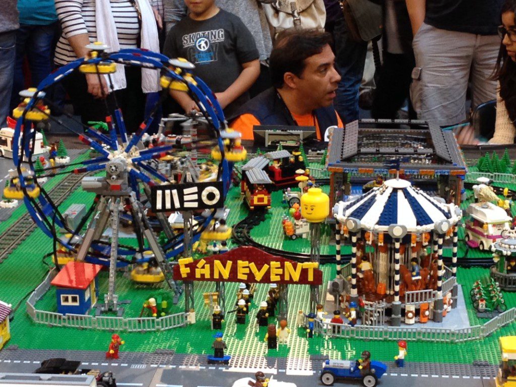 The carnival was a highlight of Smallville. Crouched behind it, in orange, is builder Nuno Caravaca.